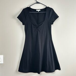 Chic Black Mini Dress with short sleeves and a flattering fit